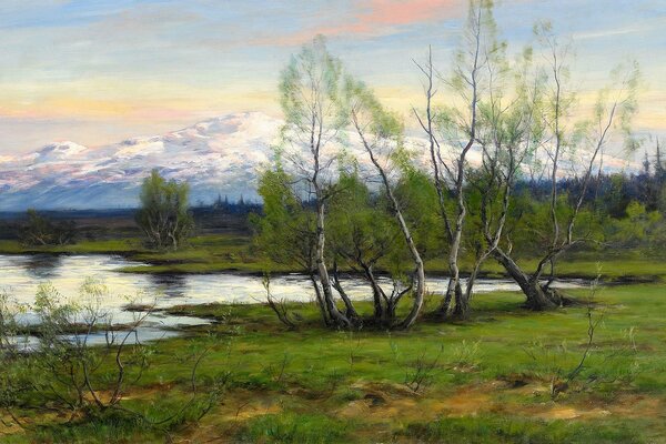 Spring trees by the river near the snowy mountains