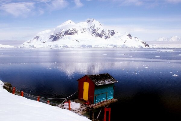 A small house on the background of the northern mountain landscape