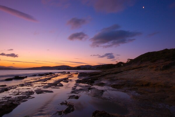 Glow in the mountains. Calm coast