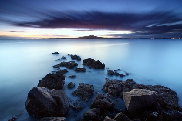 The sea is calm the stones are sleeping