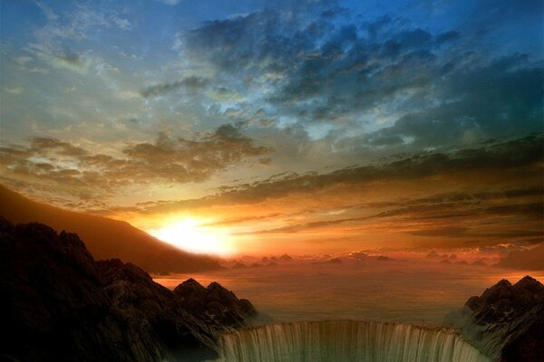 A large waterfall under the sunset sky