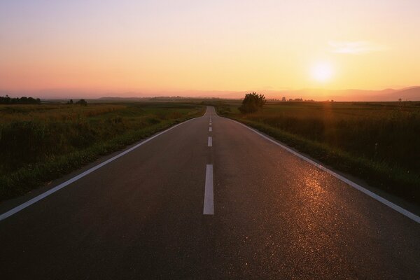 A long road and a beautiful sunset