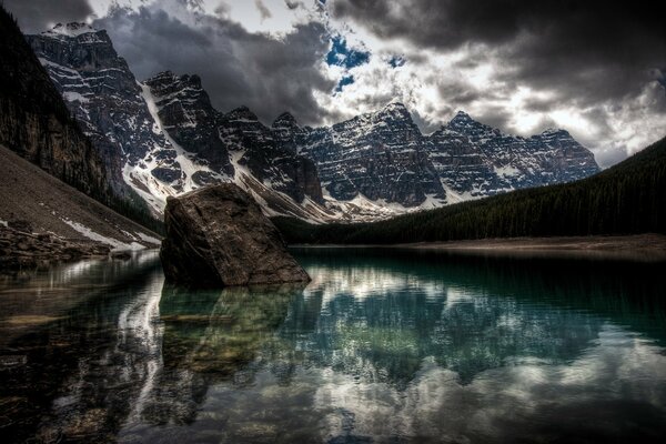 Transparent lake in the mountains with cloud display