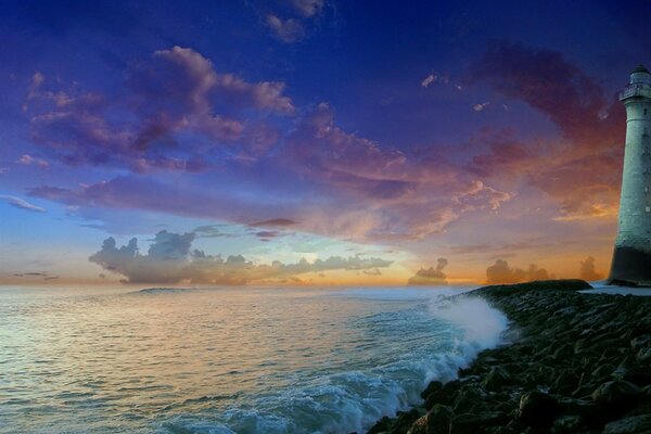 Beautiful sunset. Lighthouse on the shore of the sea