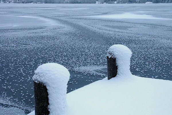 Frozen pier in gray blue