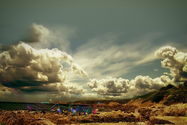 Desert. There are a lot of clouds in the sky