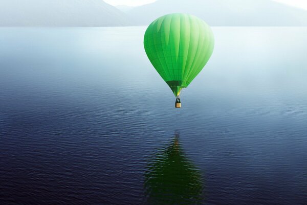 Green balloon over the lake