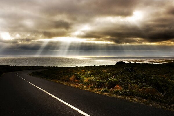 Asphalt road to the sea at dawn