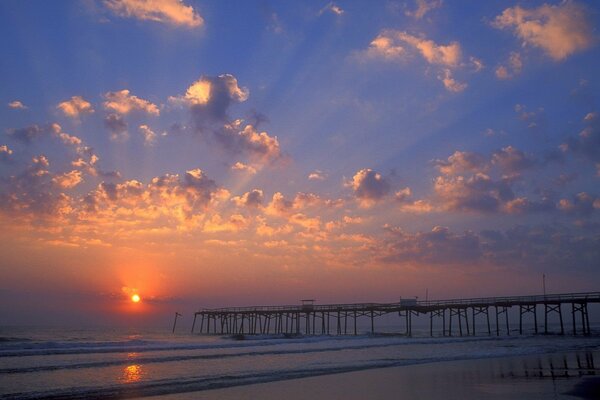 Sunset at the pier on the beach