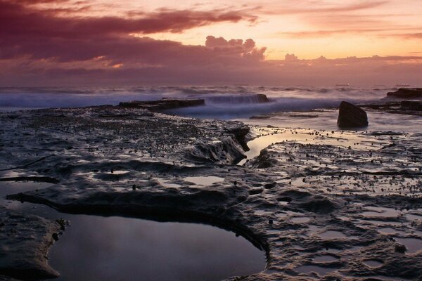 Unusual waves cover the stones