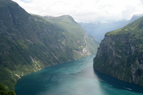 Boat on the river between the mountains