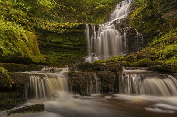 The National Park beckons with a stormy waterfall