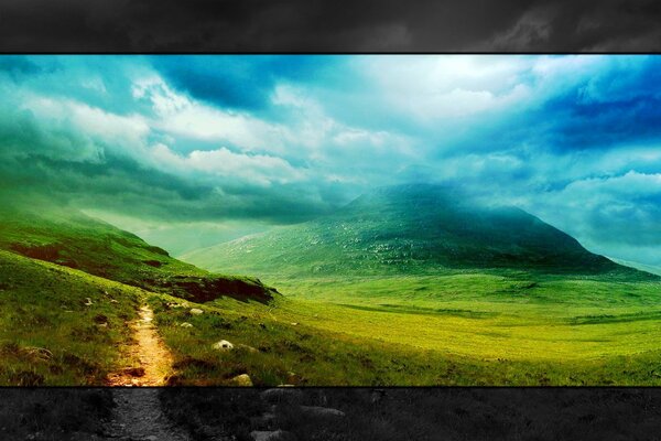 Paisaje de colinas verdes con nubes colgantes