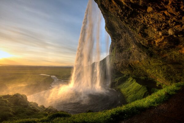 At sunrise, a beautiful waterfall