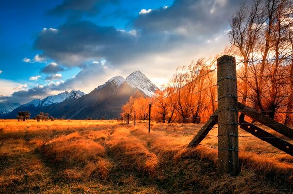 Sunrise in the mountains with illumination on the plains