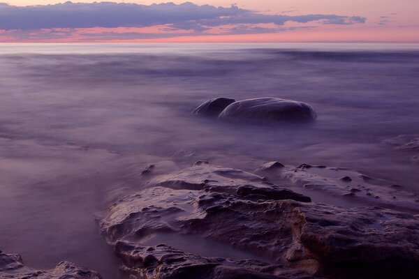 Dark stones drown in water