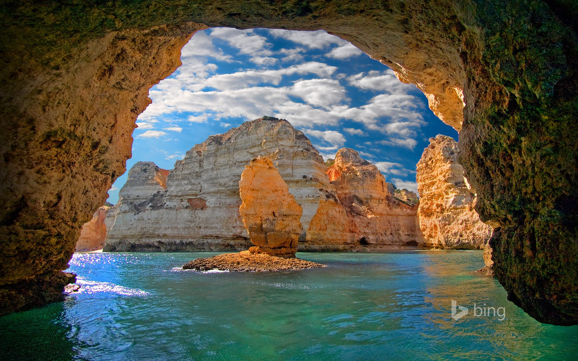 ponta da piedade lagos portugal mar rocas cueva gruta arco cielo nubes