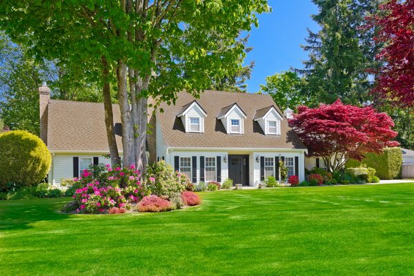 Two-storey house with a green lawn