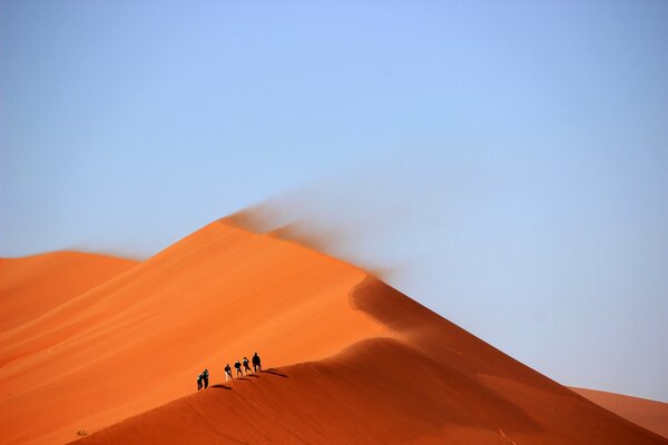 People crossing the dune