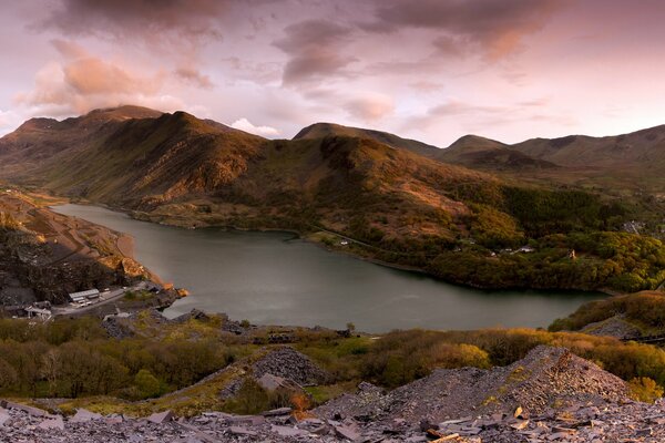 Pink sunset over the lake and mountains