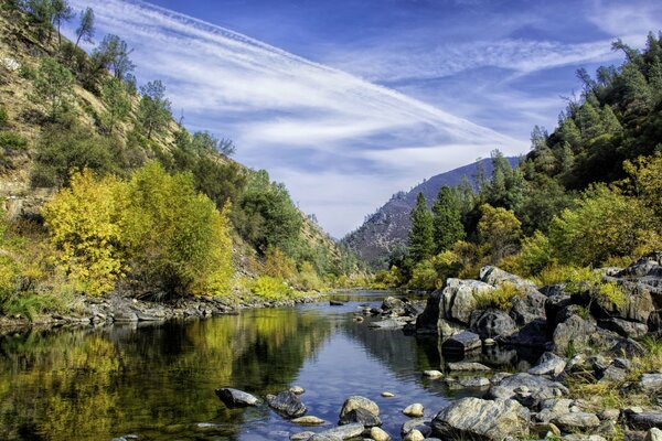 A lake in a rocky forest area