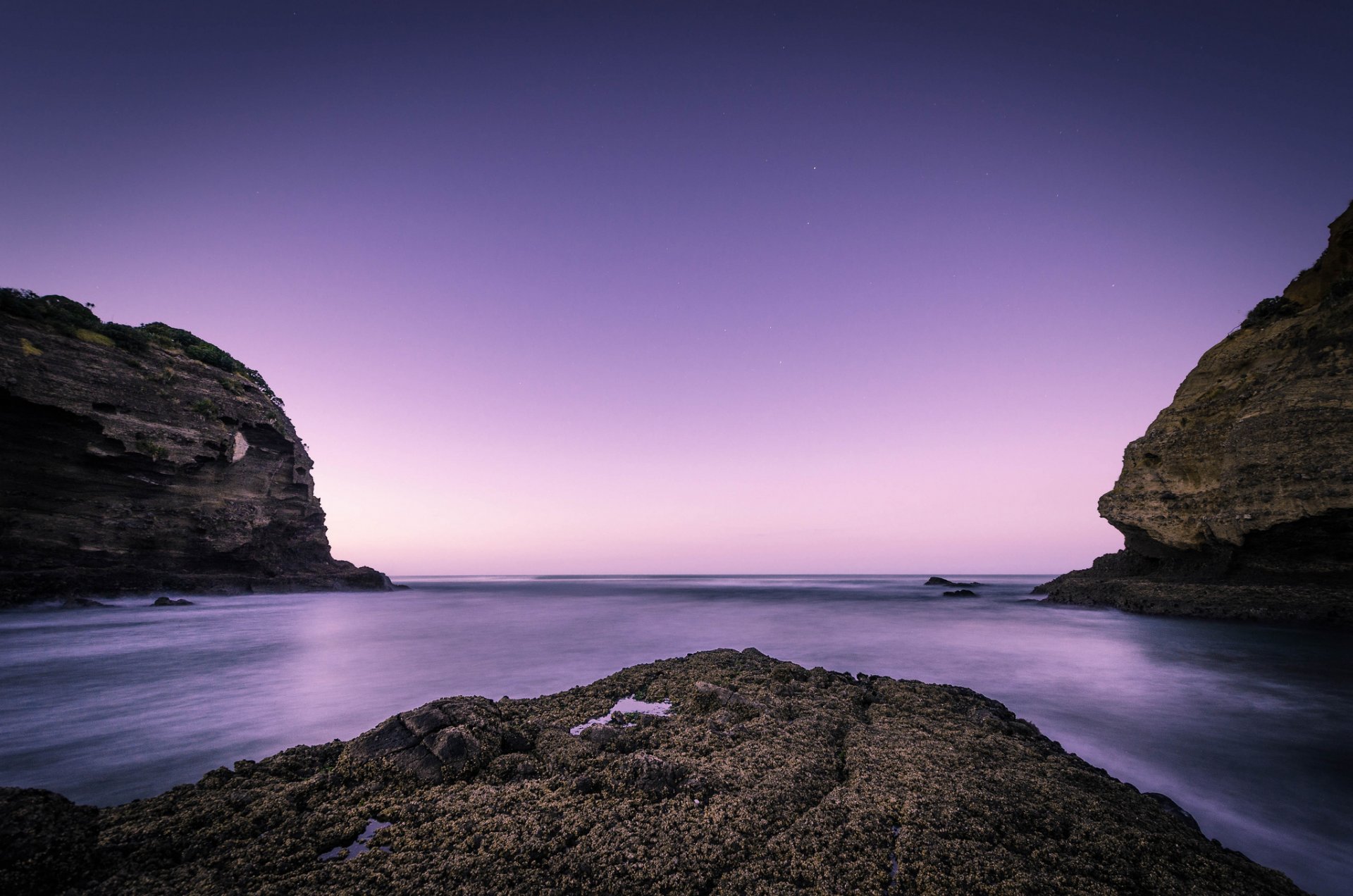 nz dawn beach rock ocean new zealand