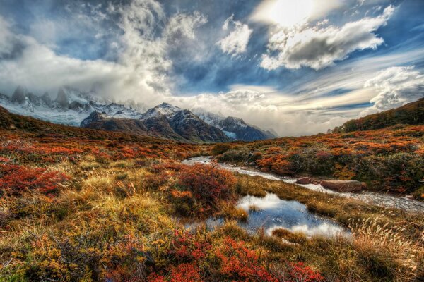 A river in the Andes against the background of clouds