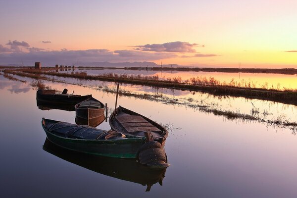 Sunset on the river with a boat