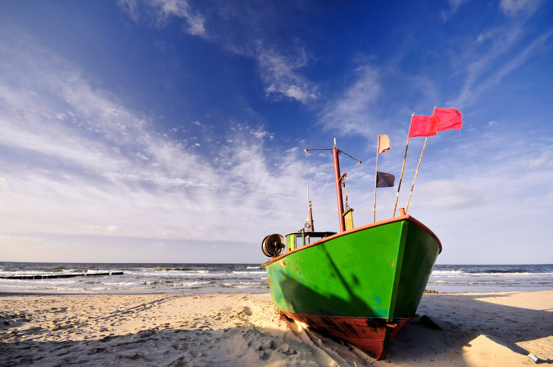 boat shore sand beach sea waves surf cloud