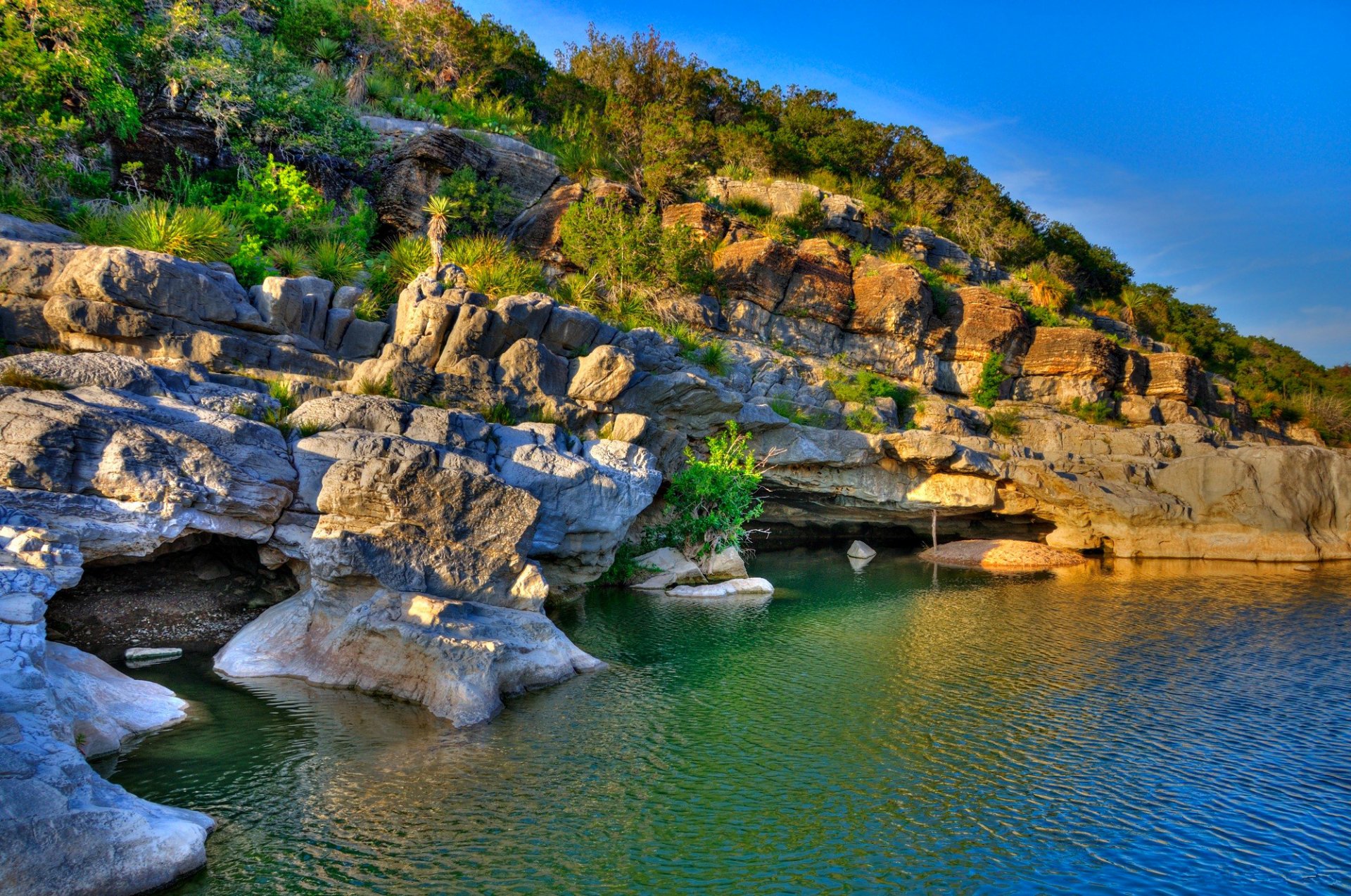 texas stati uniti cielo tramonto roccia rocce mare lago