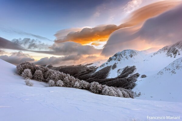 Snow-white clouds over the Apennine mountains