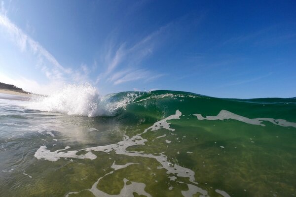 Azure wave on a blue sky background