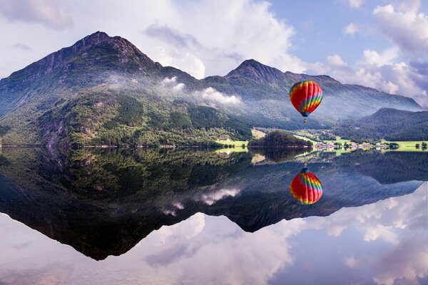 The balloon takes off over the water