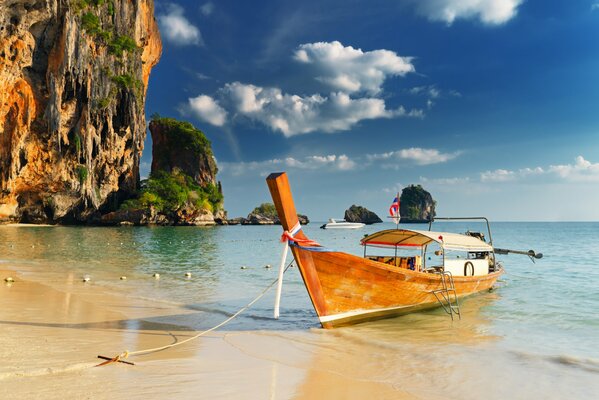 Nature with rocks and a calm shore with a boat