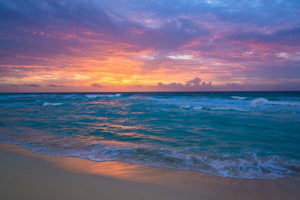 Sunrise meeting on the sand by the sea