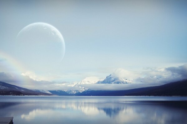 A growing moon in a cloudy sky