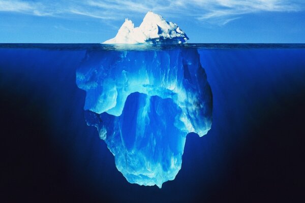 The majestic scale of an iceberg under water