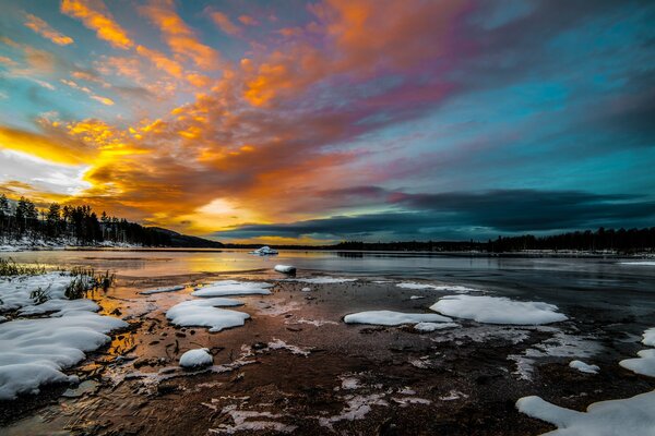 Sunrise over the lake in winter