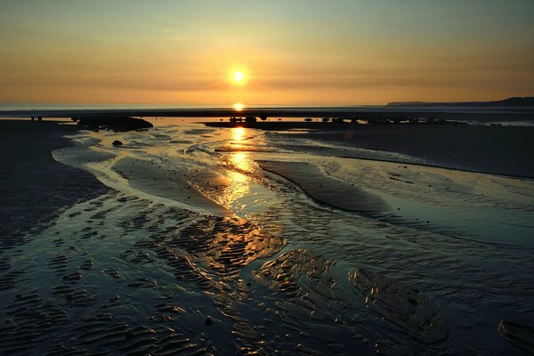 Water expanses at sunset