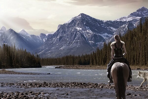 A warrior on a horse with a wolf near the mountains