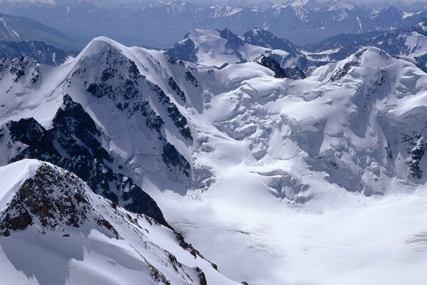 Snow-capped mountains. Sharp and dangerous rocks