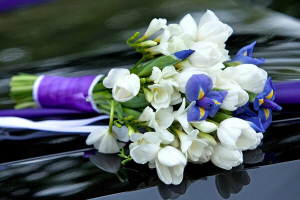 Blue irises and white tulips in a bouquet