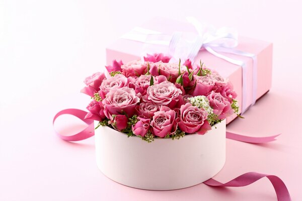 Romantic bouquet of pink roses in a gift box