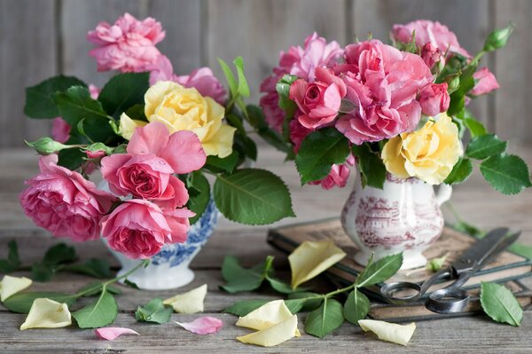 Two vases with yellow and pink flowers