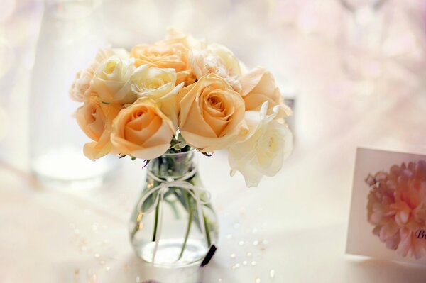 A glass vase full of orange roses