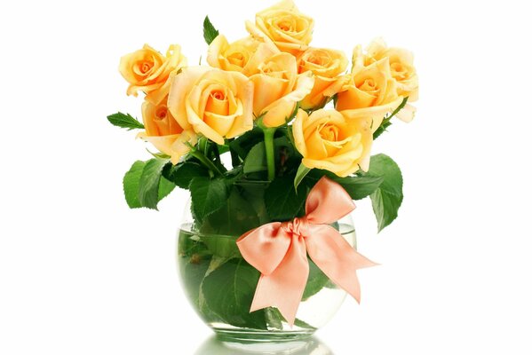 Yellow roses in a vase with an orange bow