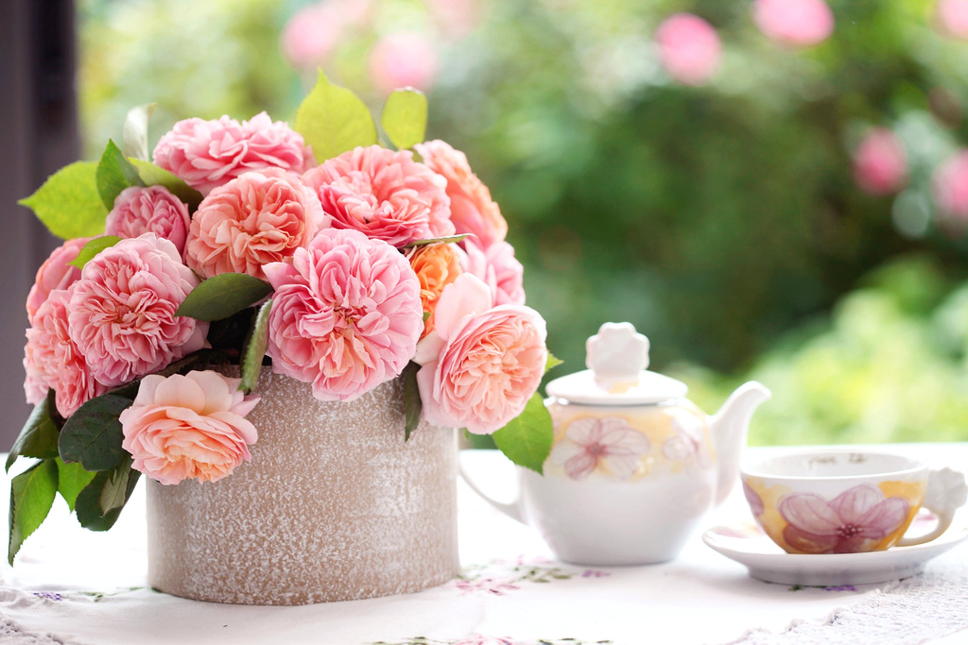 flower roses pink petals leaves bouquet table tablecloth cup saucer kettle blur