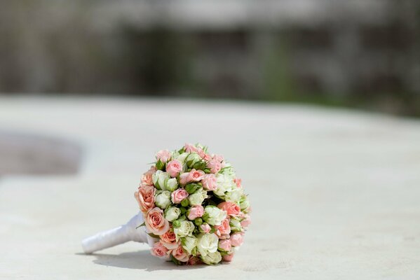 Bride s bouquet of roses on a light background