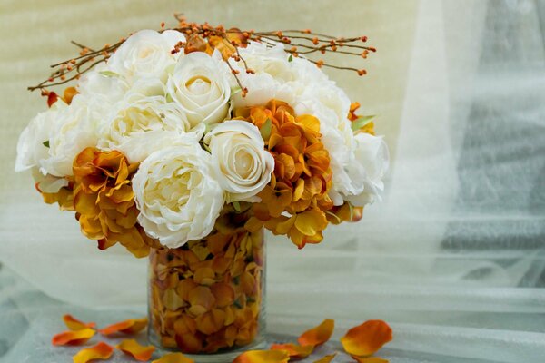 Orange and white bouquet in a vase on the table