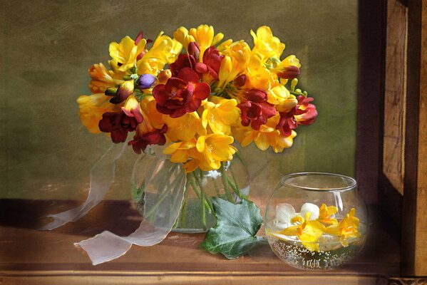 Bouquet of red and yellow flowers in a vase